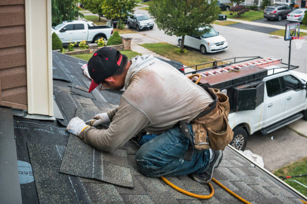 Professional Roofing technician working in Clarendon, NY